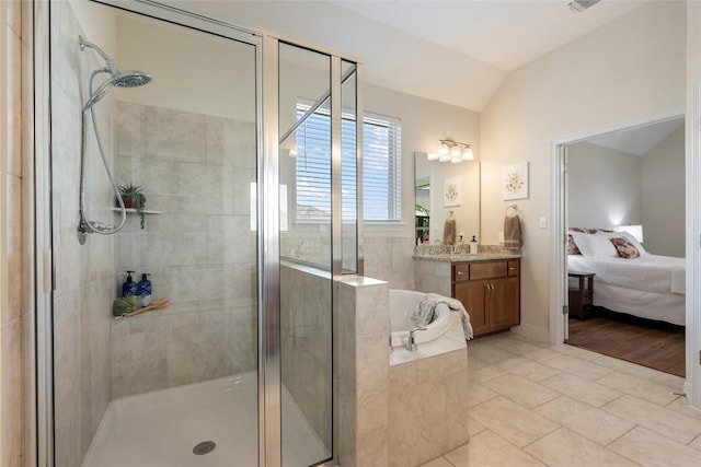 152 Baretta Loop, Buda, TX 78610 - bathroom featuring a stall shower, a bath, vanity, lofted ceiling, and connected bathroom