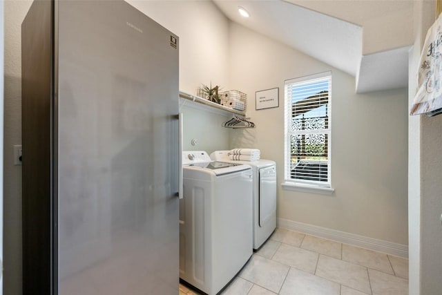 152 Baretta Loop, Buda, TX 78610 - laundry room with separate washer and dryer, baseboards, and light tile patterned flooring