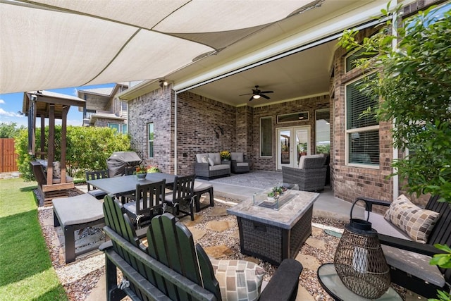 152 Baretta Loop, Buda, TX 78610 - view of patio with french doors, area for grilling, ceiling fan, and an outdoor hangout area