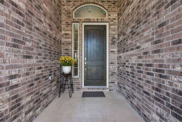 152 Baretta Loop, Buda, TX 78610 - view of exterior entry featuring brick siding