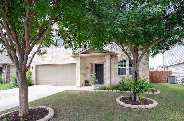 112 Moulins Ln, Georgetown, TX 78626 - view of front of house with stone siding, driveway, and an attached garage