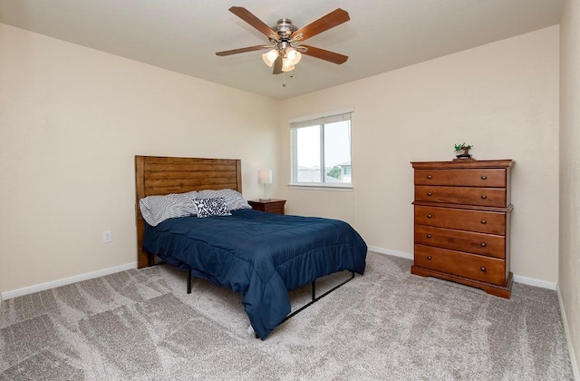 112 Moulins Ln, Georgetown, TX 78626 - carpeted bedroom with baseboards and a ceiling fan