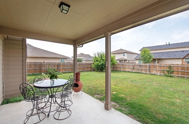 112 Moulins Ln, Georgetown, TX 78626 - fenced backyard with a patio and outdoor dining space