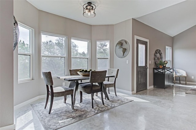 dining room featuring baseboards and a chandelier