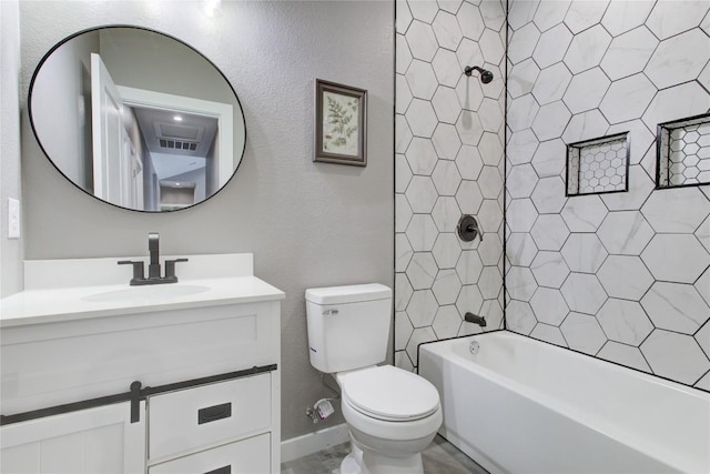 full bath with toilet, vanity, shower / tub combination, and a textured wall