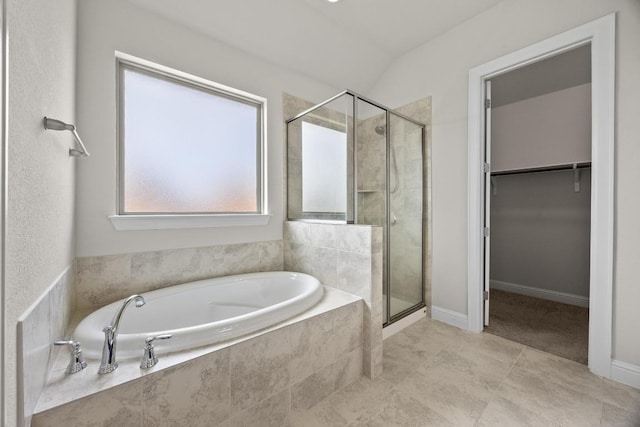 316 Barrel Bnd, Georgetown, TX 78628 - bathroom with a shower stall, a garden tub, and a walk in closet