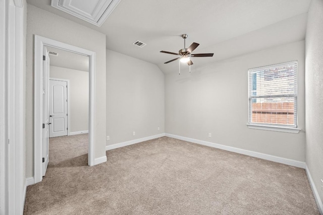 316 Barrel Bnd, Georgetown, TX 78628 - unfurnished bedroom with carpet flooring, vaulted ceiling, attic access, and baseboards
