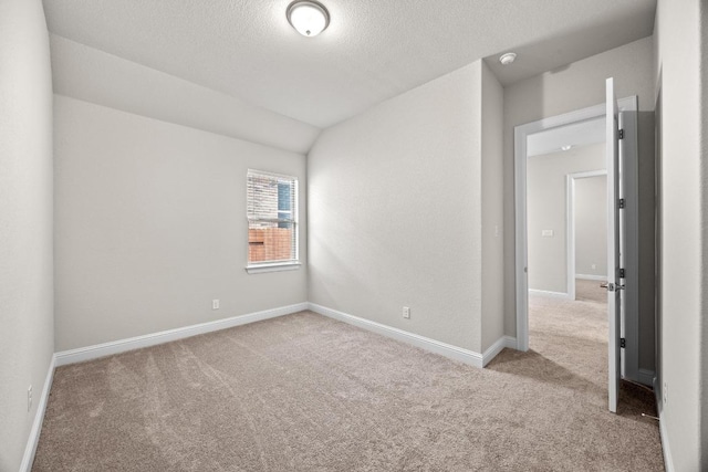 316 Barrel Bnd, Georgetown, TX 78628 - carpeted empty room with baseboards, a textured ceiling, and a smoke detector