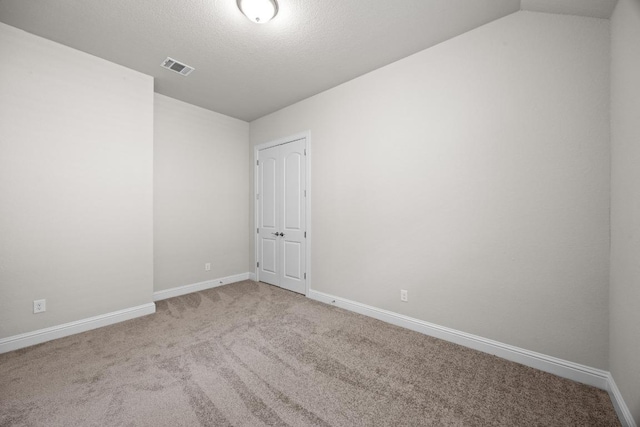 316 Barrel Bnd, Georgetown, TX 78628 - carpeted spare room with vaulted ceiling and baseboards