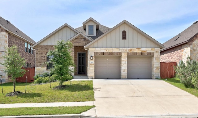 316 Barrel Bnd, Georgetown, TX 78628 - view of front facade with an attached garage, board and batten siding, concrete driveway, a shingled roof, and stone siding