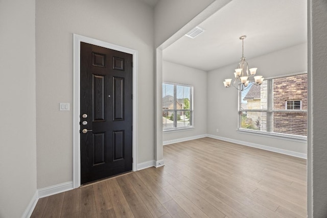 316 Barrel Bnd, Georgetown, TX 78628 - foyer entrance with a chandelier and wood finished floors