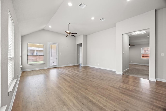 316 Barrel Bnd, Georgetown, TX 78628 - unfurnished living room featuring ceiling fan, recessed lighting, wood finished floors, lofted ceiling, and baseboards