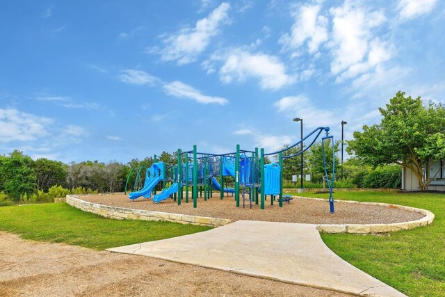316 Barrel Bnd, Georgetown, TX 78628 - community play area featuring a lawn