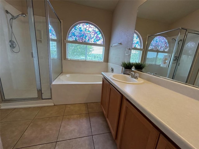 670 Covent Dr, Kyle, TX 78640 - full bathroom featuring vanity, a stall shower, a bath, and tile patterned flooring