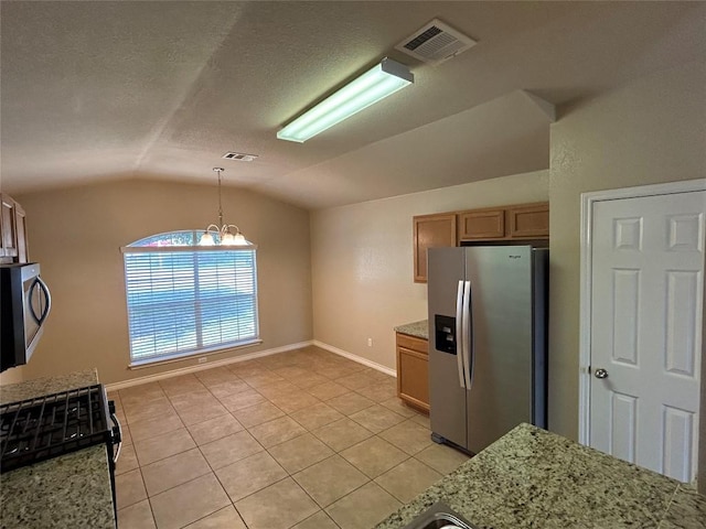 670 Covent Dr, Kyle, TX 78640 - kitchen featuring stainless steel refrigerator with ice dispenser, lofted ceiling, light tile patterned floors, baseboards, and light stone countertops