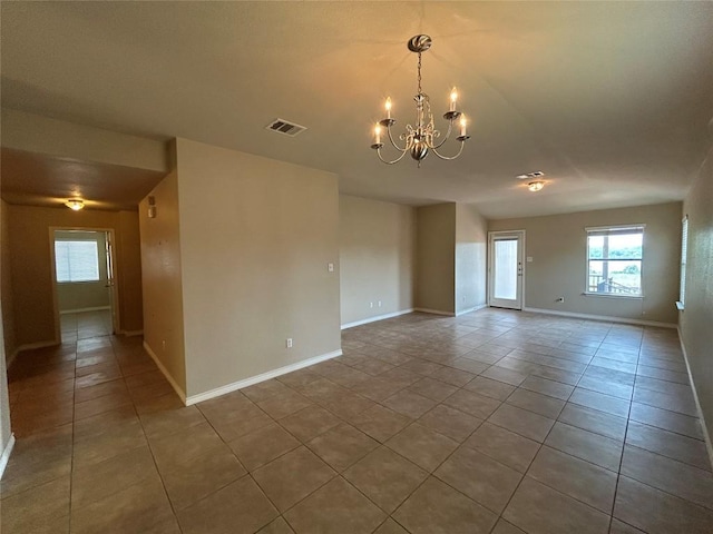 670 Covent Dr, Kyle, TX 78640 - tiled empty room with a chandelier and baseboards