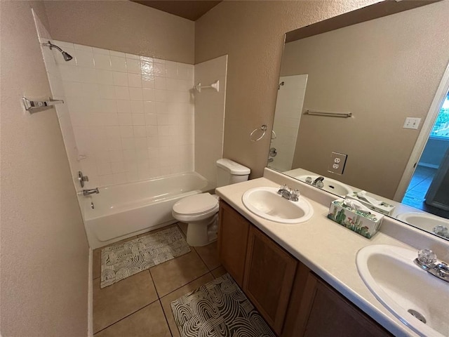 670 Covent Dr, Kyle, TX 78640 - full bath with a textured wall, toilet, tile patterned flooring, double vanity, and  shower combination