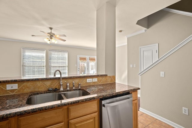 3300 Forest Creek Dr Unit 57, Round Rock, TX 78664 - kitchen with stainless steel dishwasher, a sink, crown molding, dark stone countertops, and ceiling fan
