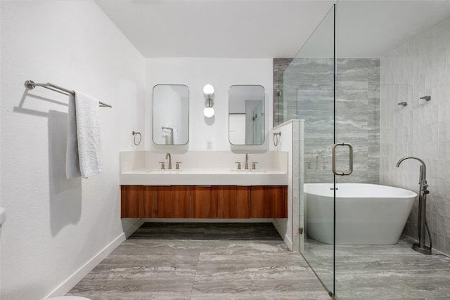 6309 Middleham Pl, Austin, TX 78745 - full bathroom with a freestanding tub, double vanity, and a tile shower