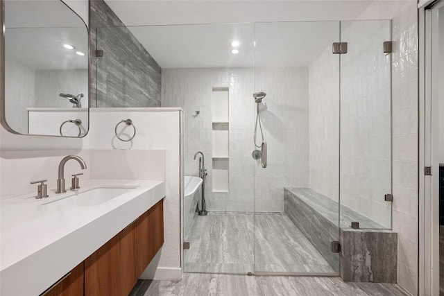 6309 Middleham Pl, Austin, TX 78745 - bathroom with a shower stall, a freestanding tub, vanity, and recessed lighting