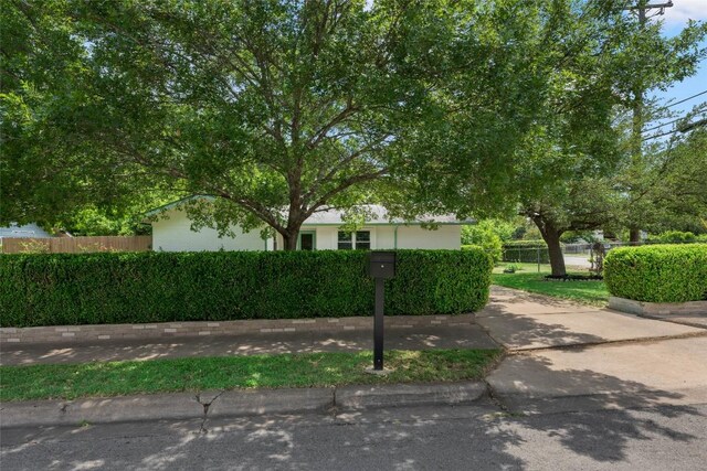 6309 Middleham Pl, Austin, TX 78745 - view of property hidden behind natural elements with stucco siding