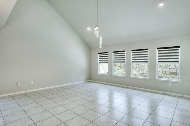3209 Ortman Dr, Pflugerville, TX 78660 - spare room featuring vaulted ceiling, baseboards, and light tile patterned flooring