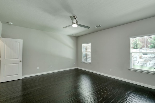 3209 Ortman Dr, Pflugerville, TX 78660 - empty room featuring a ceiling fan, healthy amount of natural light, dark wood-type flooring, and baseboards