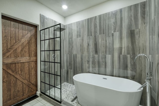 3209 Ortman Dr, Pflugerville, TX 78660 - full bathroom featuring a freestanding bath, walk in shower, and tile patterned flooring