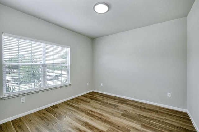 3209 Ortman Dr, Pflugerville, TX 78660 - spare room with baseboards and wood finished floors