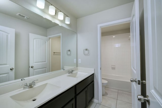 3209 Ortman Dr, Pflugerville, TX 78660 - bathroom featuring double vanity, toilet, tile patterned floors, and shower / washtub combination