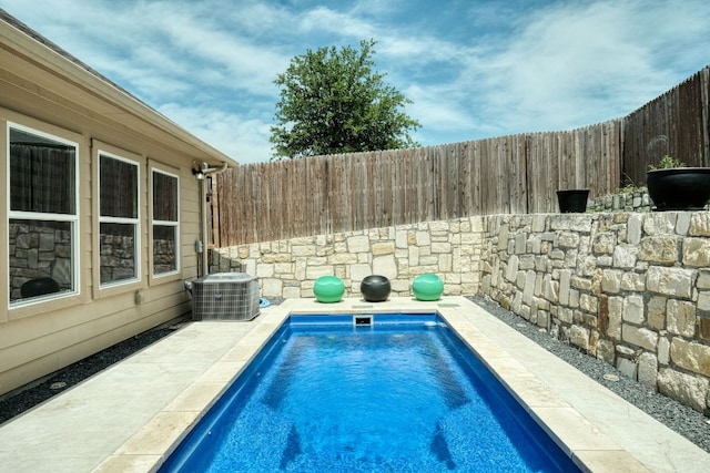 3209 Ortman Dr, Pflugerville, TX 78660 - view of swimming pool with cooling unit and a fenced backyard