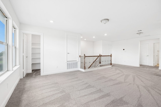 108 Redcliff Path, Kyle, TX 78640 - spare room featuring light colored carpet and recessed lighting