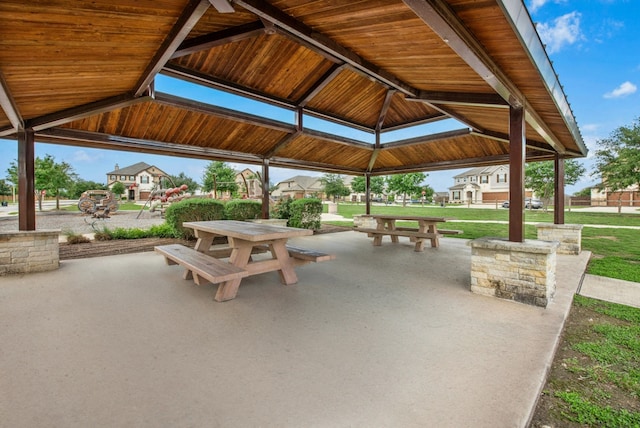 surrounding community with a gazebo and a lawn
