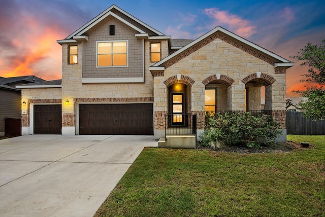 108 Redcliff Path, Kyle, TX 78640 - view of front of house with stone siding, driveway, and an attached garage