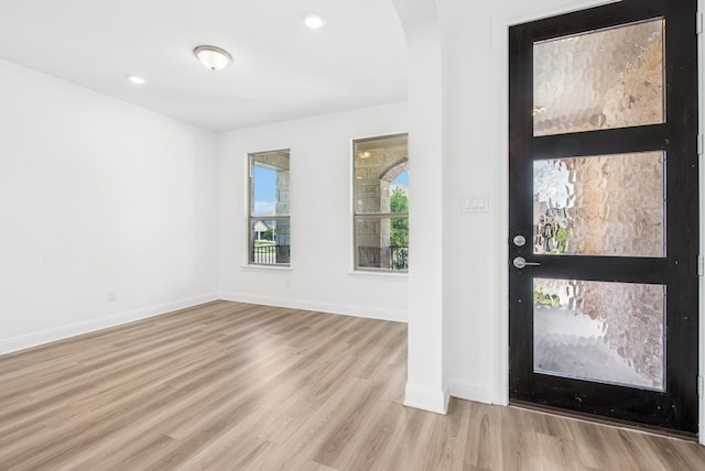 108 Redcliff Path, Kyle, TX 78640 - foyer with wood finished floors, arched walkways, and recessed lighting