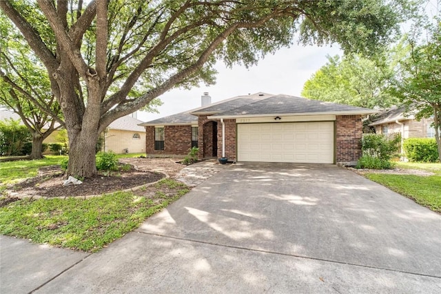 2317 Sycamore Trl, Round Rock, TX 78664 - ranch-style house featuring brick siding, driveway, an attached garage, and a chimney