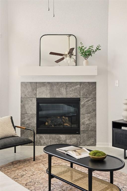 469 Durian Loop, Buda, TX 78610 - detailed view of a tiled fireplace and a ceiling fan
