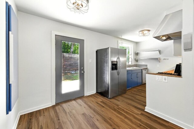 6209 Peggy St, Austin, TX 78723 - kitchen with stainless steel appliances, dark wood finished floors, healthy amount of natural light, and open shelves