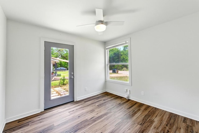 6209 Peggy St, Austin, TX 78723 - spare room featuring healthy amount of natural light, wood finished floors, and a ceiling fan