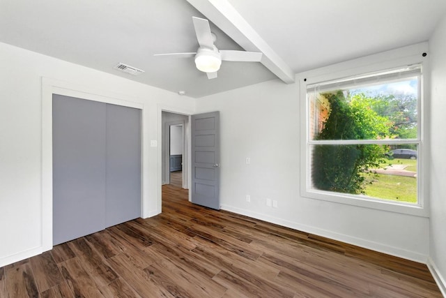 6209 Peggy St, Austin, TX 78723 - unfurnished bedroom featuring dark wood-style flooring, ceiling fan, and a closet