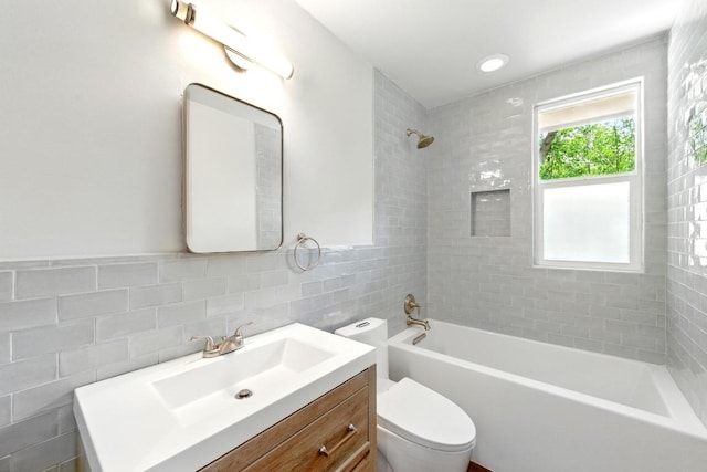6209 Peggy St, Austin, TX 78723 - full bath with tile walls, vanity, and shower / bathtub combination