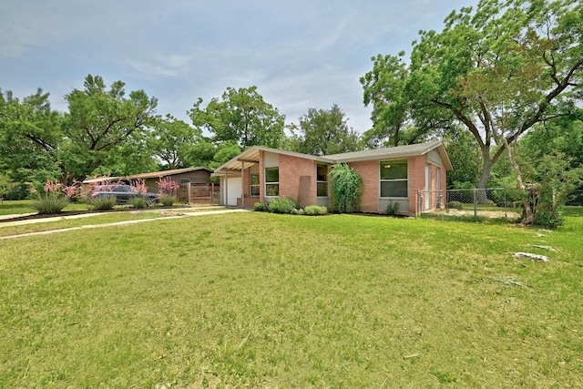 6209 Peggy St, Austin, TX 78723 - mid-century modern home with an attached garage and brick siding
