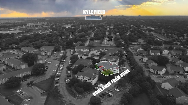 517 SW Pkwy Unit 104, College Station, TX 77840 - aerial view at dusk of a residential view