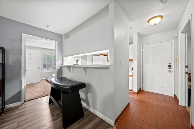 517 SW Pkwy Unit 104, College Station, TX 77840 - foyer entrance featuring baseboards