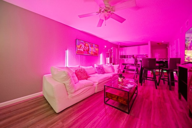 517 SW Pkwy Unit 104, College Station, TX 77840 - living area featuring wood finished floors and a ceiling fan