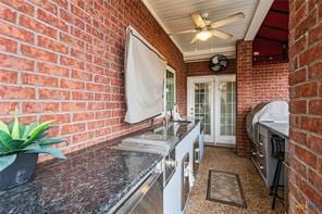 5012 Wildflower Ln, Temple, TX 76502 - view of patio featuring a ceiling fan and area for grilling