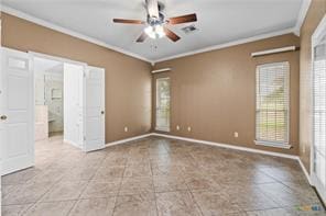 5012 Wildflower Ln, Temple, TX 76502 - unfurnished room featuring crown molding, a ceiling fan, healthy amount of natural light, and tile patterned floors