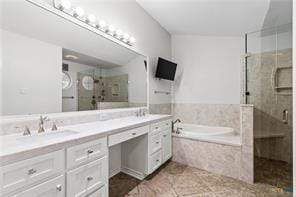 5012 Wildflower Ln, Temple, TX 76502 - bathroom with double vanity, a stall shower, a garden tub, and tile patterned flooring