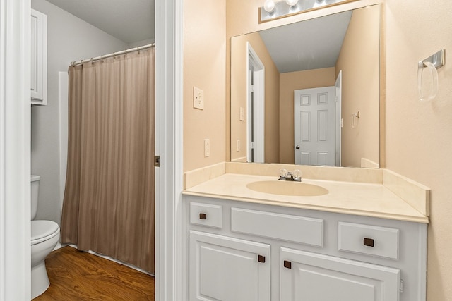 5012 Wildflower Ln, Temple, TX 76502 - full bathroom with vanity, wood finished floors, and curtained shower
