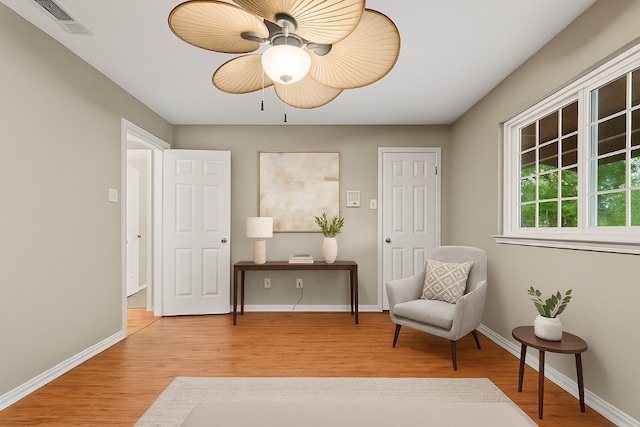 5012 Wildflower Ln, Temple, TX 76502 - living area with wood finished floors and ceiling fan